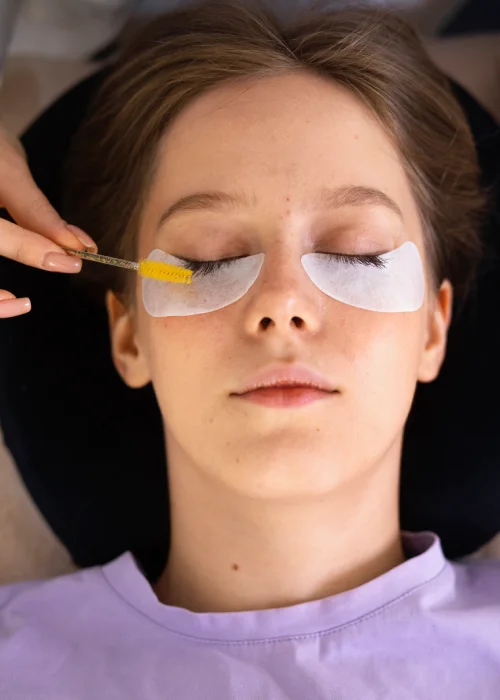 woman getting eyelash extensions at a medical spa