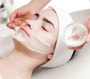 woman receiving a clinical foaming facial at a spa